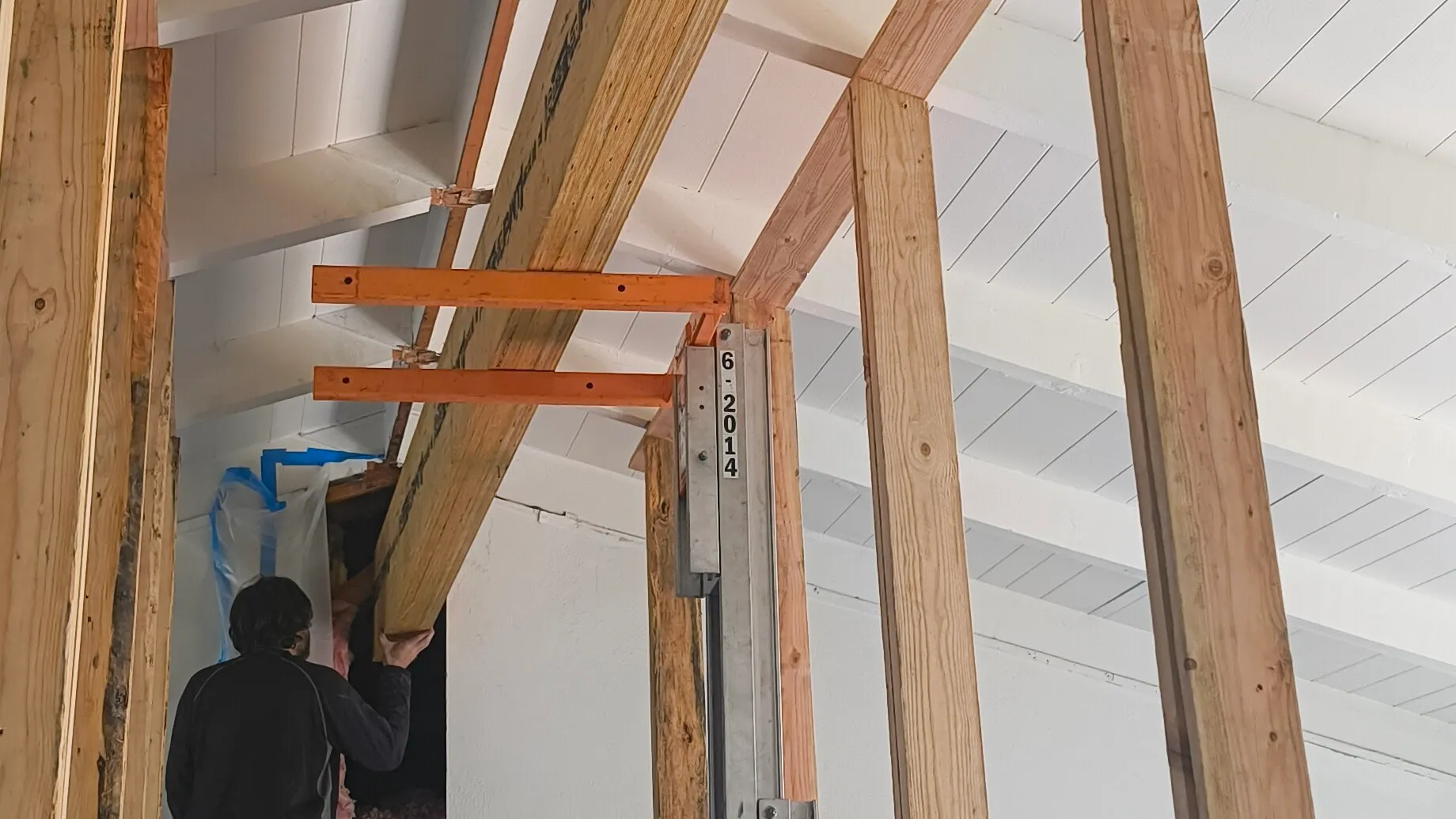 Post-and-beam framing under a plank vaulted ceiling on a CCI Builders job